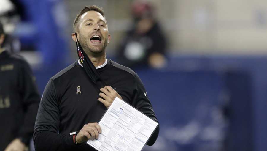 Arizona Cardinals head coach Kliff Kingsbury removes his mask to yell before an NFL football game against the Seattle Seahawks, Thursday, Nov. 19, 2020, in Seattle.