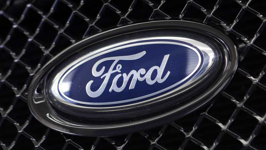 This Aug. 21, 2014 file photo shows the Ford logo on a vehicle at a dealership in Hialeah, Fla.