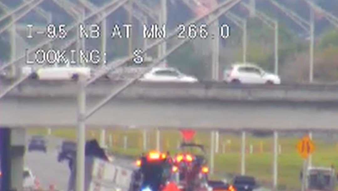 Tractor-trailer overturned in multi-car crash that shut down I-95
