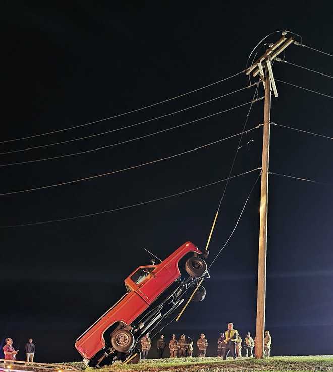 Pickup truck drives up onto telephone pole wire in Lancaster County, Pa.