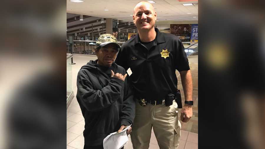 Gabriel poses with Vacaville Police Sgt. David Kellis at the airport on Thursday, Oct. 20, 2016, before boarding his plane to Hawaii. The Community Response Unit helped Gabriel reunite with his family.