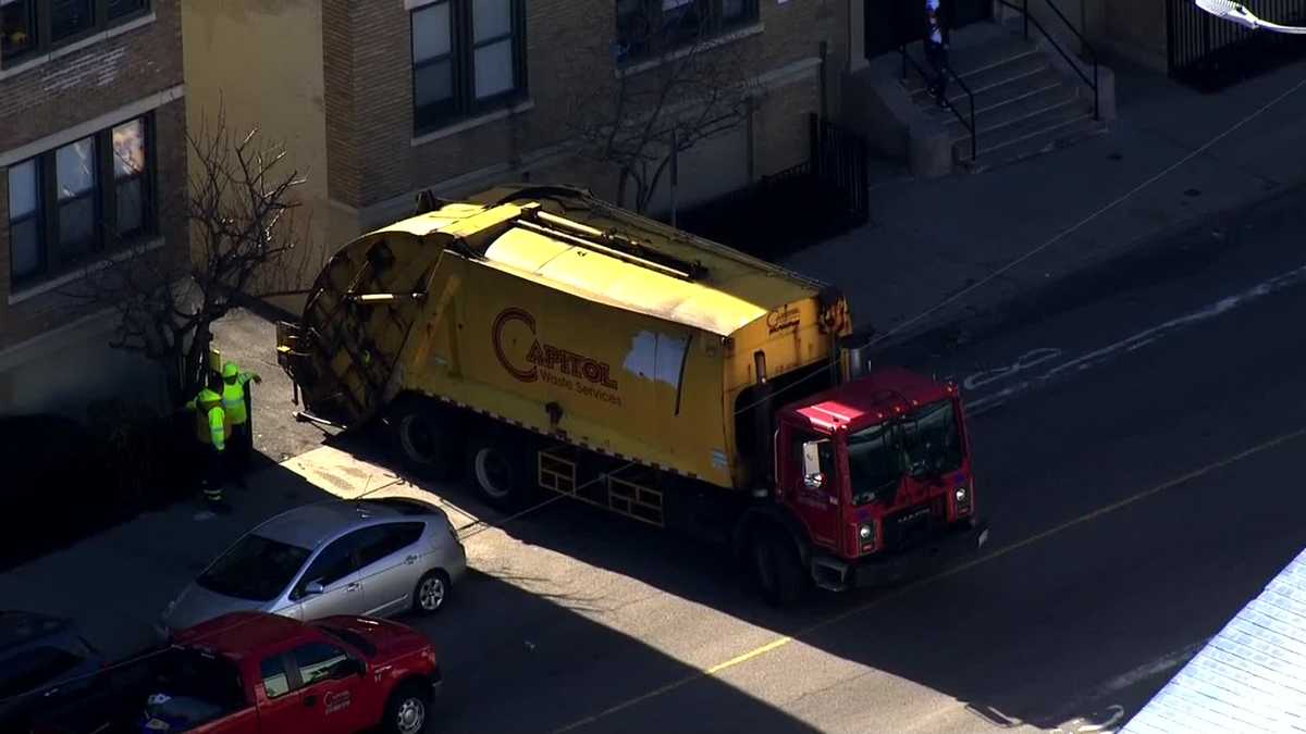 Pedestrian struck by trash truck in Boston