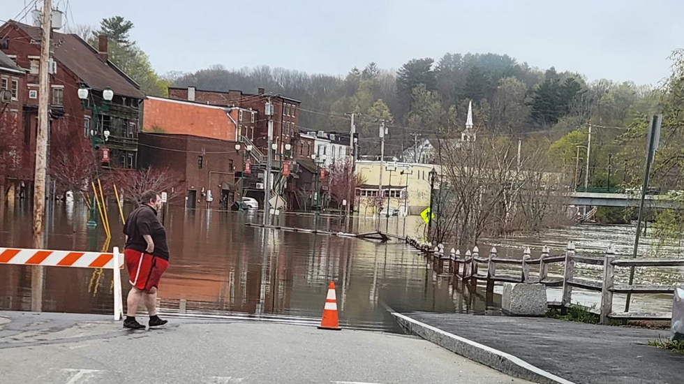 Kennebec River crests, spilling onto streets, flooding restaurant patio