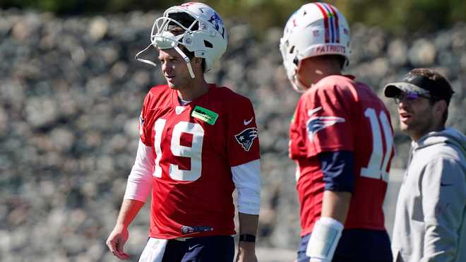 New England Patriots quarterback Brian Hoyer (5) tosses the ball during the  first half of an NFL preseason football game against the Las Vegas Raiders,  Friday, Aug. 26, 2022, in Las Vegas. (