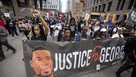 People march for the one year anniversary of George Floyd's death on Sunday, May 23, 2021, in Minneapolis, Minn. 