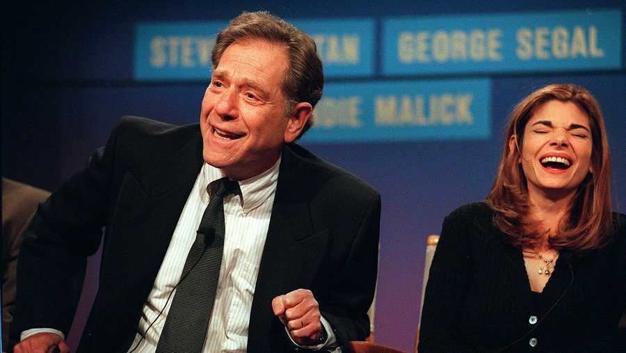 Cast members from the NBC "Just Shoot Me," George Segal, left, and Laura San-Giacomo appear at the TCA winter press tour in Pasadena, Calif.