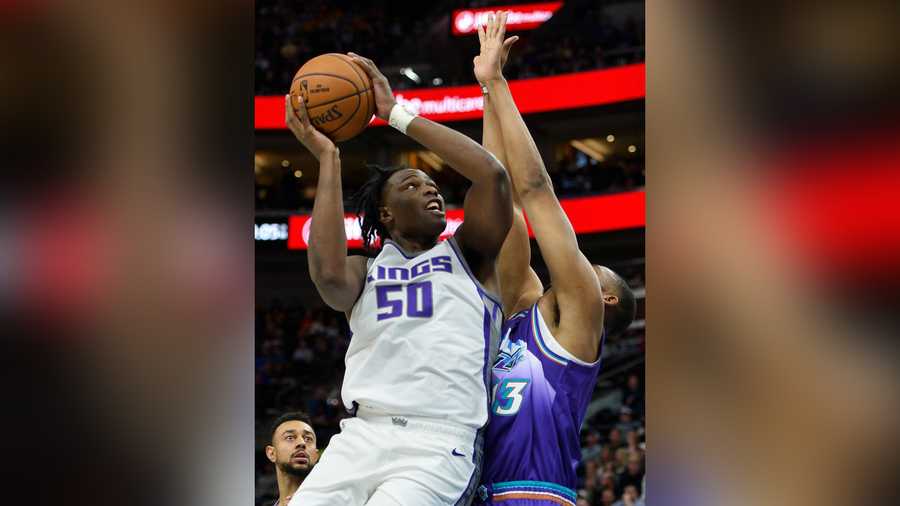 SALT LAKE CITY, UT - OCTOBER 26: Caleb Swanigan #50 of the Sacramento Kings attempts a shot over Tony Bradley #13 of the Utah Jazz during a game at Vivint Smart Home Arena on October 26, 2019 in Salt Lake City, Utah. NOTE TO USER: User expressly acknowledges and agrees that, by downloading and or using this photograph, User is consenting to the terms and conditions of the Getty Images License Agreement.  (Photo by Alex Goodlett/Getty Images)