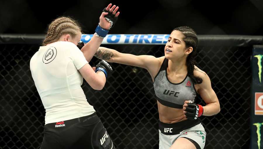 Polyana Viana punches JJ Aldrich in the first round of their straw weight bout during UFC 227 at Staples Center on Aug. 4, 2018 in Los Angeles.