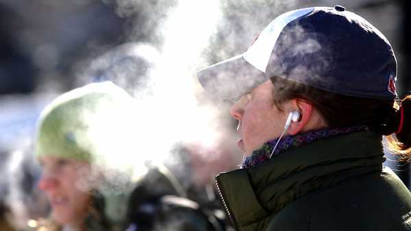 Haleigh Harren is enveloped by the vapor of her own breath on a very cold Friday morning as she waits for a bus on Broadway.'(Photo by Paul Aiken/Digital First Media/Boulder Daily Camera via Getty Images)