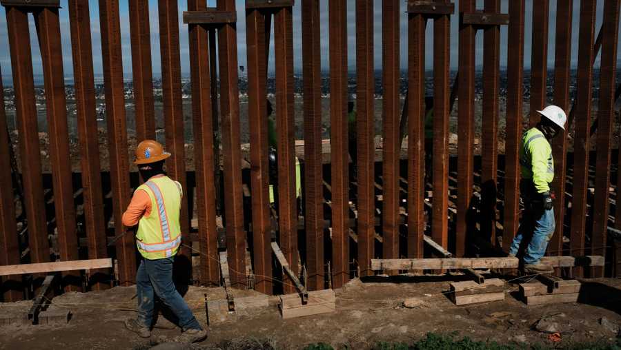 Mexican workers repair a steel border fence in the city of Tijuana on January 16, 2019, in Tijuana, Mexico. The U.S. government is partially shutdown as President Donald Trump is asking for $5.7 billion to build additional walls along the U.S.-Mexico border and the Democrats oppose the idea.