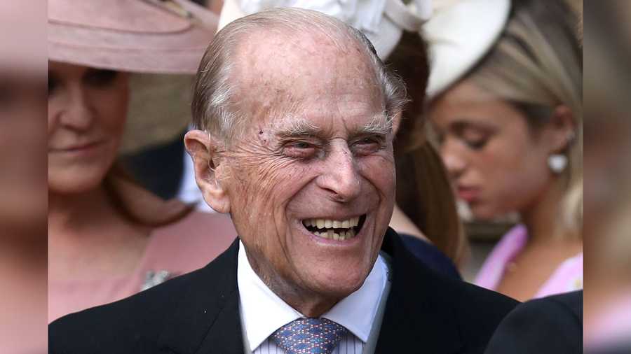 Britain's Prince Philip, Duke of Edinburgh reacts as he talks with Britain's Prince Harry, Duke of Sussex as they leave St George's Chapel in Windsor Castle, Windsor, west of London, on May 18, 2019, after the wedding of Lady Gabriella Windsor and Thomas Kingston.