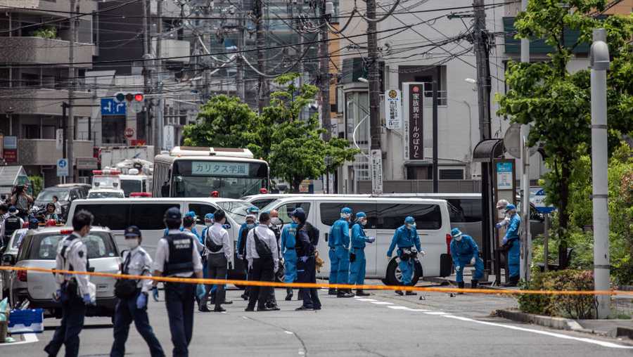 Police officers work at the scene of a mass stabbing on May 28, 2019 in Kawasaki, Japan. Around sixteen people, including children, were injured after a man attacked people with a knife near a park in the Noborito area of Kawasaki just outside Tokyo.