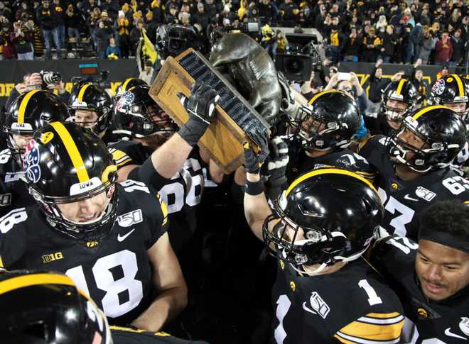 IOWA&#x20;CITY,&#x20;IOWA-&#x20;NOVEMBER&#x20;16&#x3A;&#x20;Offensive&#x20;linemen&#x20;Levi&#x20;Paulsen&#x20;&#x23;66&#x20;and&#x20;Tristan&#x20;Wirfs&#x20;&#x23;74&#x20;of&#x20;the&#x20;Iowa&#x20;Hawkeyes&#x20;lifts&#x20;the&#x20;Floyd&#x20;of&#x20;Rosedale&#x20;trophy&#x20;after&#x20;the&#x20;win&#x20;over&#x20;the&#x20;Minnesota&#x20;Gophers&#x20;on&#x20;November&#x20;16,&#x20;2019&#x20;at&#x20;Kinnick&#x20;Stadium&#x20;in&#x20;Iowa&#x20;City,&#x20;Iowa.&#x20;&#x20;&#x28;Photo&#x20;by&#x20;Matthew&#x20;Holst&#x2F;Getty&#x20;Images&#x29;
