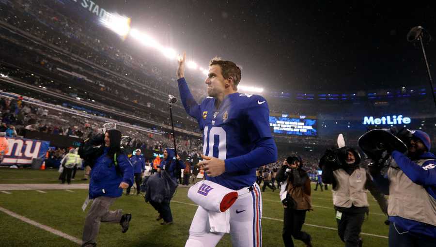 Eli Manning #10 of the New York Giants runs off the field after a game against the Philadelphia Eagles at MetLife Stadium on Dec. 29, 2019.