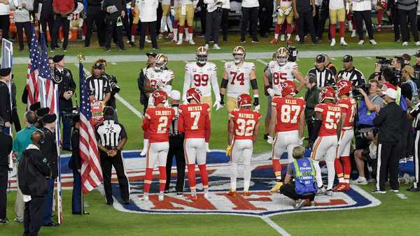 MIAMI, FLORIDA - FEBRUARY 02:  The San Francisco 49ers captains and Kansas City Chiefs captains stand together at the 50 yard line for the coin toss prior to the start of Super Bowl LIV against the Kansas City Chiefs at Hard Rock Stadium on February 02, 2020 in Miami, Florida. The Chiefs won the game 31-20. (Photo by Focus on Sport/Getty Images) *** Local Caption ***