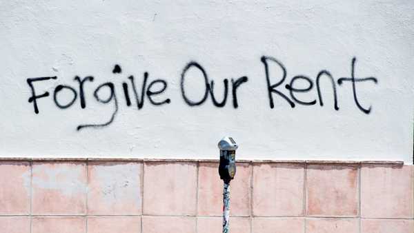 A graffiti asking for rent forgiveness is seen on a wall on La Brea Ave on National May Day amid the Covid-19 pandemic, May 1, 2020, in Los Angeles, CaliforniaBut when the lockdown lifts, the moratorium will end. And tenants will have to pay their back-rent or move out. (Photo by VALERIE MACON / AFP) (Photo by VALERIE MACON/AFP via Getty Images)