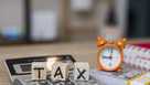 Tax on Wooden Blocks on Top of Work Desk Space