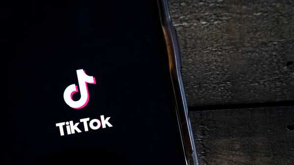 WASHINGTON, DC - AUGUST 07: In this photo illustration, the TikTok app is displayed on an Apple iPhone on August 7, 2020 in Washington, DC. On Thursday evening, President Donald Trump signed an executive order that bans any transactions between the parent company of TikTok, ByteDance, and U.S. citizens due to national security reasons. The president signed a separate executive order banning transactions with China-based tech company Tencent, which owns the app WeChat. Both orders are set to take effect in 45 days. (Photo Illustration by Drew Angerer/Getty Images)