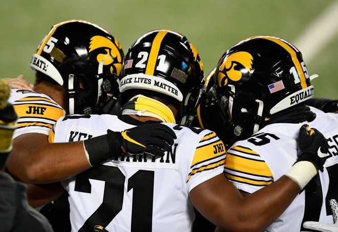 MINNEAPOLIS,&#x20;MINNESOTA&#x20;-&#x20;NOVEMBER&#x20;13&#x3A;&#x20;Ivory&#x20;Kelly-Martin&#x20;&#x23;21&#x20;of&#x20;the&#x20;Iowa&#x20;Hawkeyes&#x20;huddles&#x20;with&#x20;teammates&#x20;before&#x20;the&#x20;game&#x20;against&#x20;the&#x20;Minnesota&#x20;Golden&#x20;Gophers&#x20;at&#x20;TCF&#x20;Bank&#x20;Stadium&#x20;on&#x20;November&#x20;13,&#x20;2020&#x20;in&#x20;Minneapolis,&#x20;Minnesota.&#x20;&#x28;Photo&#x20;by&#x20;Hannah&#x20;Foslien&#x2F;Getty&#x20;Images&#x29;