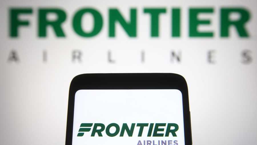 UKRAINE - 2021/06/17: In this photo illustration, Frontier Airlines logo is seen on a smartphone and a pc screen in the background. (Photo Illustration by Pavlo Gonchar/SOPA Images/LightRocket via Getty Images)