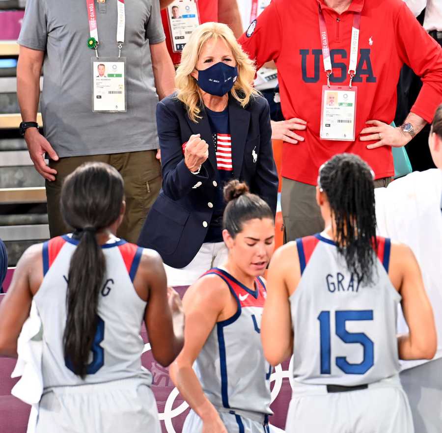 TOKYO, JAPAN - JULY 24: US First Lady Jill Biden (C) congratulates US women 3x3 basketball team after the women's first-round 3x3 basketball match between US and France at the Aomi Urban Sports Park in Tokyo, Japan on July 24, 2021. (Photo by Mustafa Yalcin/Anadolu Agency via Getty Images)