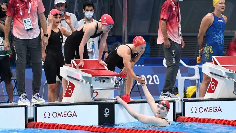 (From R) Britain&apos;s Anna Hopkin, Freya Anderson, Lucy Hope and Abbie Wood celebrate after winning a heat for the women&apos;s 4x100m freestyle relay swimming event during the Tokyo 2020 Olympic Games at the Tokyo Aquatics Centre in Tokyo on July 24, 2021. (Photo by Attila KISBENEDEK / AFP) (Photo by ATTILA KISBENEDEK/AFP via Getty Images)
