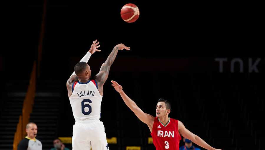 SAITAMA, JAPAN - JULY 28: (BILD ZEITUNG OUT) Damian Lillard of USA and Mohammadsina Vahedi of Iran battle for the ball during the Basketball Preliminary Round Group A Match between United States and Islamic Republic of Iran on day five of the Tokyo 2020 Olympic Games at Saitama Super Arena on July 28, 2021 in Saitama, Japan. (Photo by Berengui/DeFodi Images via Getty Images)