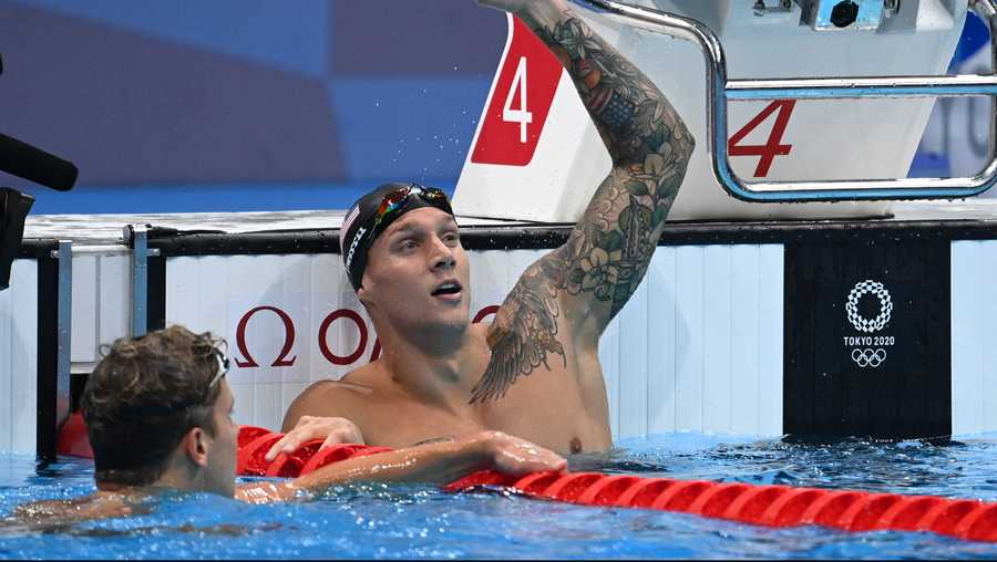 USA&apos;s Caeleb Dressel celebrates winning to take gold and set a new World Record in the final of the men&apos;s 100m butterfly swimming event during the Tokyo 2020 Olympic Games at the Tokyo Aquatics Centre in Tokyo on July 31, 2021. (Photo by Jonathan NACKSTRAND / AFP) (Photo by JONATHAN NACKSTRAND/AFP via Getty Images)