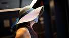 A woman wears a mask as she arrives to Penn station in New York on Aug. 2, 2021.