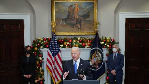 President Joe Biden, flanked by Vice President Kamala Harris (L) and Dr. Anthony Fauci, delivers remarks to provide an update on the omicron variant in the Roosevelt Room of the White House in Washington, DC on November 29, 2021.