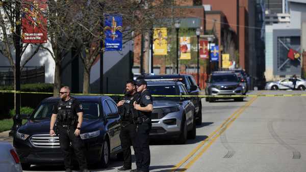 LOUISVILLE, KY - APRIL 10: Police officers gather outside the front entrance of the Old National Bank building after a gunman opened fire on April 10, 2023 in Louisville, Kentucky. According to reports, there are multiple fatalities and injuries. The shooter died at the scene. (Photo by Luke Sharrett/Getty Images)