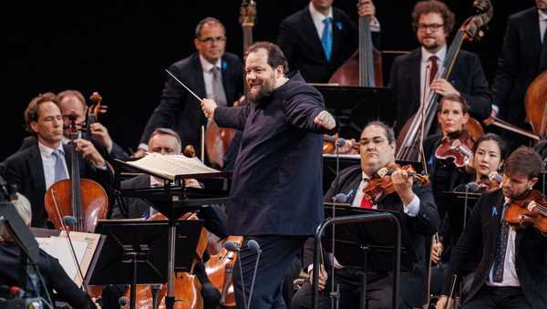 24 June 2023, Berlin: Under their conductor Andris Nelsons, the Berlin Philharmonic Orchestra will perform a concert at Berlin's Waldbühne. The concert traditionally marks the end of the Philharmonic's season. Photo: Carsten Koall/dpa (Photo by Carsten Koall/picture alliance via Getty Images)