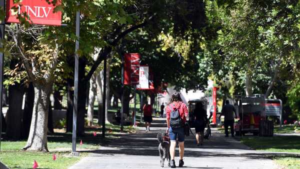 LAS VEGAS, NEVADA - SEPTEMBER 09:  A UNLV student walks on campus after attending a class at UNLV amid the spread of the coronavirus (COVID-19) on September 9, 2020 in Las Vegas, Nevada. To lower the number of people on campus to allow for social distancing because of the pandemic, the university moved fall 2020 courses with more than 50 students, about 80 percent of its classes, to remote instruction, with 20 percent of courses held in-person or hybrid. UNLV is only using large classrooms with spaced out seating and under 50 percent capacity for in-person classes, which are now staggered to reduce density on the campus.  (Photo by Ethan Miller/Getty Images)