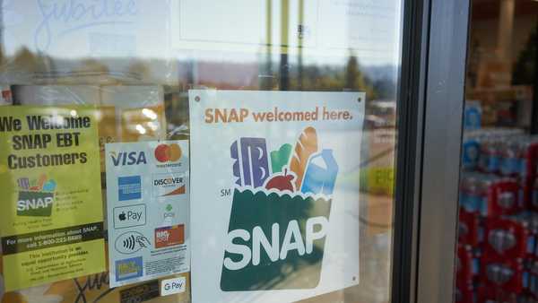 Portland, OR, USA - Oct 28, 2020: "SNAP welcomed here" sign is seen at the entrance to a Big Lots store in Portland, Oregon. The Supplemental Nutrition Assistance Program (SNAP) is a federal program.