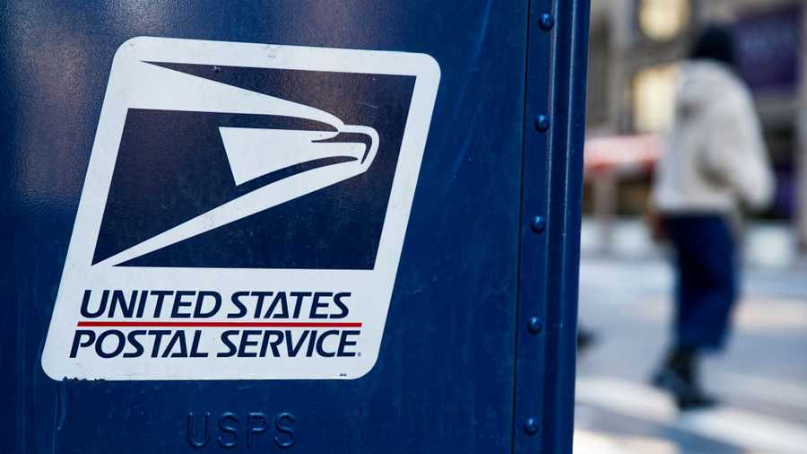 NEW YORK, NEW YORK - FEBRUARY 24: A USPS logo is seen on a mailbox on February 24, 2021, in New York City. The U.S Postal Service awarded a 10-year multi-billion dollar contract to Wisconsin-based Oshkosh Defense to replace its vehicles.