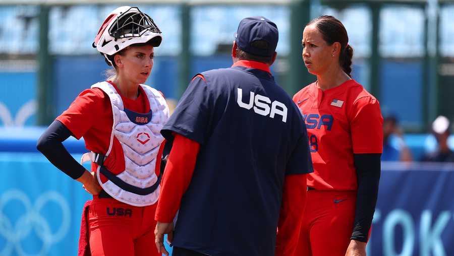 FUKUSHIMA, JAPAN - JULY 21: Team United States head coach Ken Eriksen talks with catcher Aubree Munro #1 and pitcher Catherine Osterman #38 at the mound in the third inning of the game against Team Italy during the Tokyo 2020 Olympic Games at Fukushima Azuma Baseball Stadium on July 21, 2021 in Fukushima, Japan. (Photo by Yuichi Masuda/Getty Images)