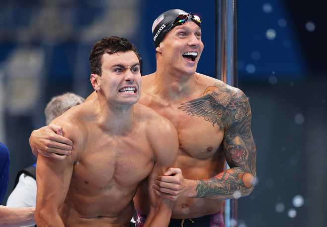 Blake&#x20;Pieroni&#x20;of&#x20;Team&#x20;United&#x20;States&#x20;and&#x20;Caeleb&#x20;Dressel&#x20;of&#x20;Team&#x20;United&#x20;States&#x20;celebrate&#x20;after&#x20;winning&#x20;the&#x20;gold&#x20;medal&#x20;in&#x20;the&#x20;Men&#x27;s&#x20;4&#x20;x&#x20;100m&#x20;Freestyle&#x20;Relay&#x20;Final&#x20;on&#x20;day&#x20;three&#x20;of&#x20;the&#x20;Tokyo&#x20;2020&#x20;Olympic&#x20;Games&#x20;at&#x20;Tokyo&#x20;Aquatics&#x20;Centre&#x20;on&#x20;July&#x20;26,&#x20;2021&#x20;in&#x20;Tokyo,&#x20;Japan.