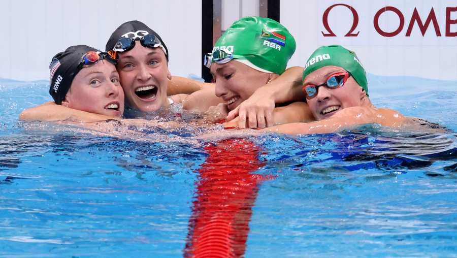 Tatjana Schoenmaker of Team South Africa (C) is congratulated by Lilly King of Team United States (1L),  Annie Lazor of Team United States (2L) and Kaylene Corbett of Team South Africa (R) after winning the gold medal and breaking the world record after competing in the Women&apos;s 200m Breaststroke Final on day seven of the Tokyo 2020 Olympic Games at Tokyo Aquatics Centre on July 30, 2021 in Tokyo, Japan. (Photo by Harry How/Getty Images)
