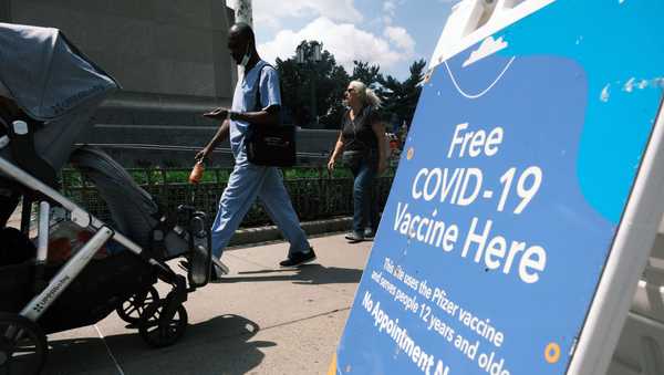 A city-operated mobile pharmacy advertises the COVID-19 vaccine in a Brooklyn neighborhood on July 30, 2021 in New York City.