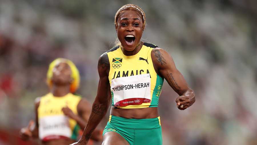 Elaine Thompson-Herah of Team Jamaica celebrates after winning the gold medal in the women's 100m Final on day eight of the Tokyo 2020 Olympic Games at Olympic Stadium on July 31, 2021 in Tokyo, Japan. (Photo by Cameron Spencer/Getty Images)