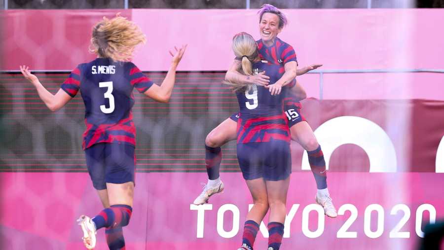 Megan Rapinoe #15 of United States celebrates her goal with Lindsey Horan #9 during the Olympic football bronze medal match between United States and Australia at Kashima Stadium on August 05, 2021 in Kashima, Ibaraki, Japan. (Photo by Zhizhao Wu/Getty Images)