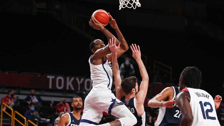 Kevin Durant #7 of Team United States shoots against Nando de Colo #12 of Team France during the first half of a Men's Basketball Finals game on day fifteen of the Tokyo 2020 Olympic Games at Saitama Super Arena on August 7, 2021 in Saitama, Japan. (Photo by Kevin C. Cox/Getty Images)