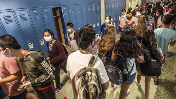 Jericho, N.Y.: Students walk through the hallway wearing masks as they return to class on the first day of school at the Jericho, New York school district on August 26, 2021.  (Photo by Alejandra Villa Loarca/Newsday RM via Getty Images)