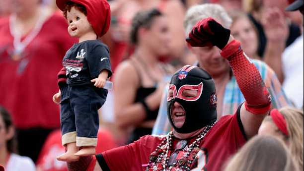 TAMPA, FLORIDA - OCTOBER 24: A Tampa Bay Buccaneers fan cheers during the game between the Chicago Bears and Tampa Bay Buccaneers at Raymond James Stadium on October 24, 2021 in Tampa, Florida. (Photo by Douglas P. DeFelice/Getty Images)