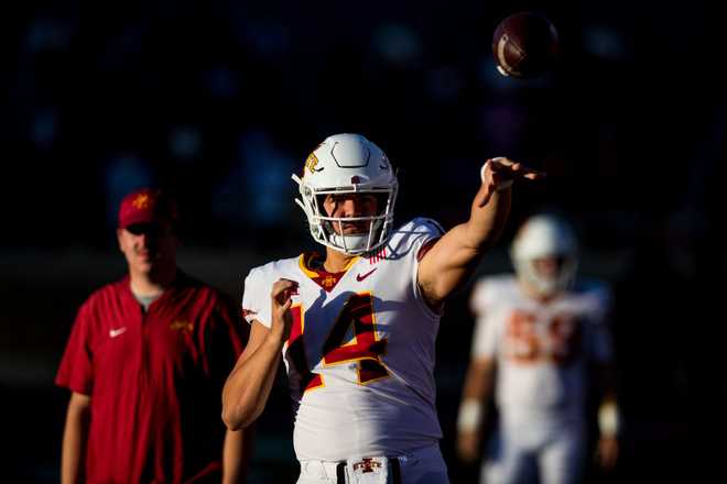 LUBBOCK,&#x20;TEXAS&#x20;-&#x20;NOVEMBER&#x20;13&#x3A;&#x20;Quarterback&#x20;Aidan&#x20;Bouman&#x20;&#x23;14&#x20;of&#x20;the&#x20;Iowa&#x20;State&#x20;Cyclones&#x20;passes&#x20;the&#x20;ball&#x20;during&#x20;the&#x20;second&#x20;half&#x20;of&#x20;the&#x20;college&#x20;football&#x20;game&#x20;against&#x20;the&#x20;Texas&#x20;Tech&#x20;Red&#x20;Raiders&#x20;at&#x20;Jones&#x20;AT&amp;amp&#x3B;T&#x20;Stadium&#x20;on&#x20;November&#x20;13,&#x20;2021&#x20;in&#x20;Lubbock,&#x20;Texas.&#x20;&#x28;Photo&#x20;by&#x20;John&#x20;E.&#x20;Moore&#x20;III&#x2F;Getty&#x20;Images&#x29;