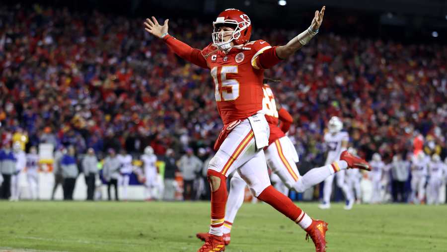 Patrick Mahomes #15 of the Kansas City Chiefs celebrates a touchdown scored by Tyreek Hill #10 against the Buffalo Bills during the fourth quarter in the AFC Divisional Playoff game at Arrowhead Stadium on January 23, 2022 in Kansas City, Missouri.