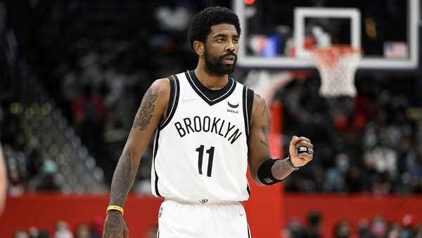 WASHINGTON, DC - FEBRUARY 10: Kyrie Irving #11 of the Brooklyn Nets gestures during the second quarter against the Washington Wizards at Capital One Arena on February 10, 2022 in Washington, DC. NOTE TO USER: User expressly acknowledges and agrees that, by downloading and or using this photograph, User is consenting to the terms and conditions of the Getty Images License Agreement.  (Photo by Greg Fiume/Getty Images)