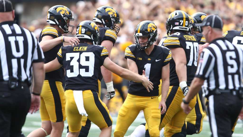 Iowa kicker charged in gambling sting allegedly won a bet on the