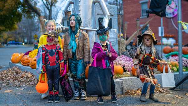 CHARLOTTE, VERMONT - OCTOBER 31: Children wearing costumes trick or treat at the annual Halloween party October 31, 2022 in Charlotte, Vermont.  (Photo by Robert Nickelsberg/Getty Images)
