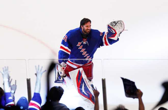 NEW&#x20;YORK,&#x20;NY&#x20;-&#x20;MAY&#x20;14&#x3A;&#x20;&#x20;Henrik&#x20;Lundqvist&#x20;&#x23;30&#x20;of&#x20;the&#x20;New&#x20;York&#x20;Rangers&#x20;waves&#x20;to&#x20;the&#x20;crowd&#x20;after&#x20;their&#x20;3&#x20;to&#x20;0&#x20;win&#x20;over&#x20;the&#x20;New&#x20;Jersey&#x20;Devils&#x20;in&#x20;Game&#x20;One&#x20;of&#x20;the&#x20;Eastern&#x20;Conference&#x20;Final&#x20;during&#x20;the&#x20;2012&#x20;NHL&#x20;Stanley&#x20;Cup&#x20;Playoffs&#x20;at&#x20;Madison&#x20;Square&#x20;Garden&#x20;on&#x20;May&#x20;14,&#x20;2012&#x20;in&#x20;New&#x20;York&#x20;City.&#x20;&#x20;&#x28;Photo&#x20;by&#x20;Paul&#x20;Bereswill&#x2F;Getty&#x20;Images&#x29;